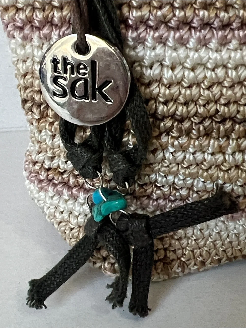 The Sak Beige and Cream Crocheted Cosmetic Pouch with Charm